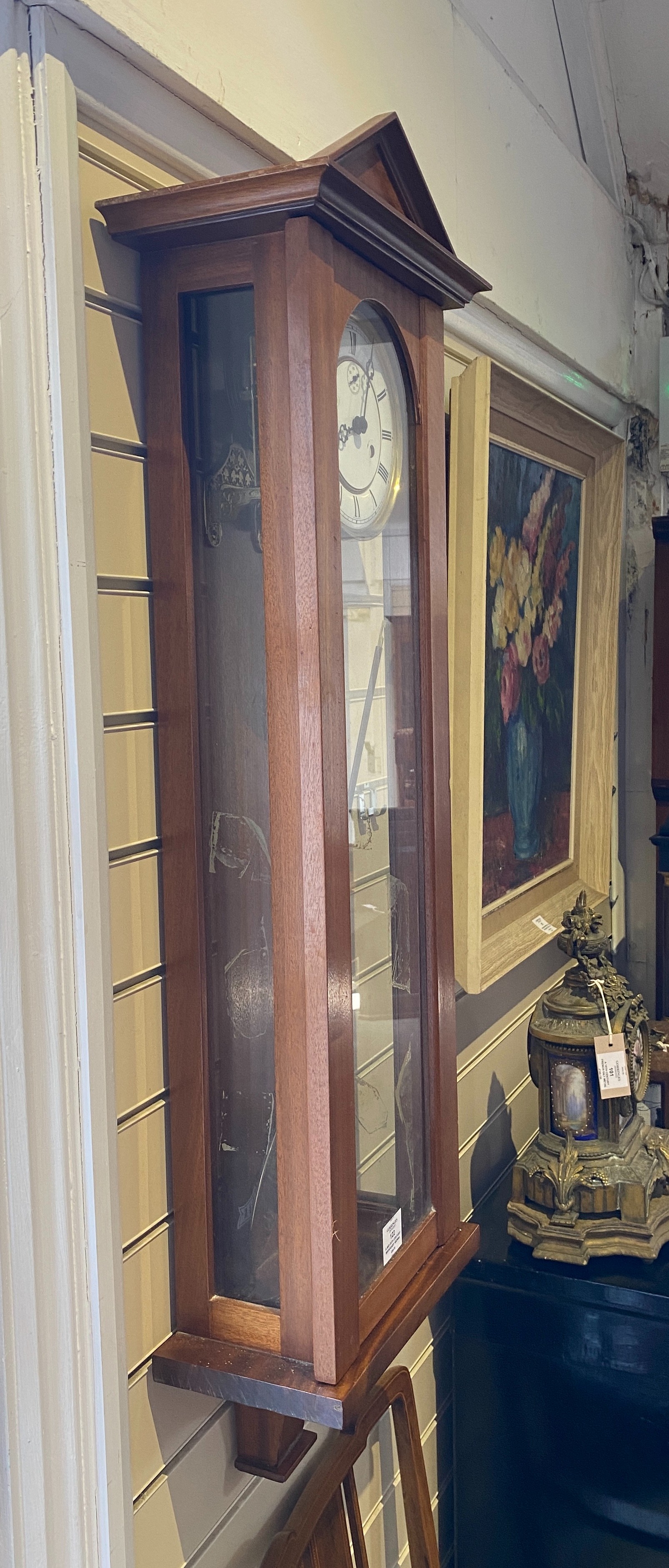 A mid 20th century mahogany Vienna type 8 day wall clock the circular white enamel dial with subsidiary seconds, height 112 cms.